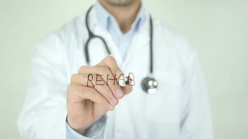 Rehab, Doctor Writing on Transparent Screen
