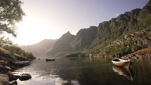 Nestled Within the Embrace of a Norwegian Fjord a Wooden Rowing Boat is Moored to a Buoy Creating a