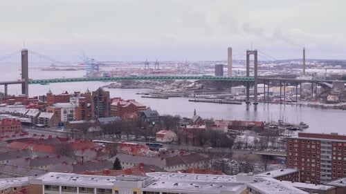 Panoramic aerial riser reveals Älvsborg bridge over Göta älv river, Gothenburg