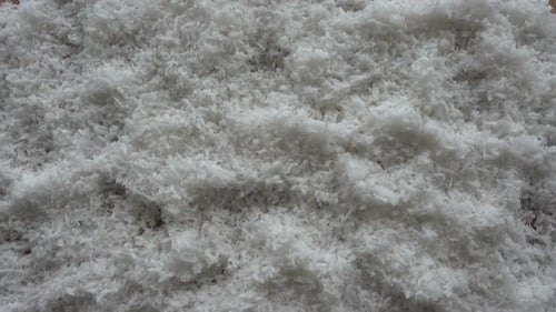 Hojuelas de coco ralladas. Ingrediente dietético natural de frutos secos