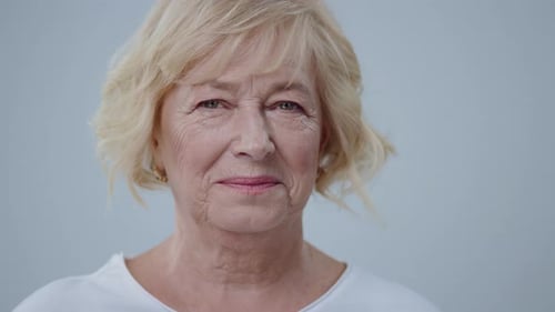 Close Up of Smiling Senior Woman with Blonde Hair