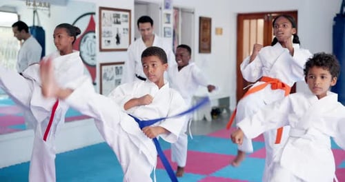 Children Practicing Karate in an Indoor Studio