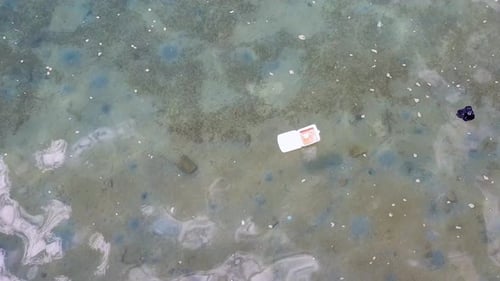 Plastic pollution in ocean caused by human rubbish and waste, floating and polluting the ocean envir