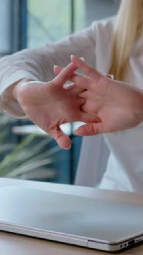 Satisfied Caucasian Businesswoman Completing Working with Laptop Stretching Hands Listen Music in