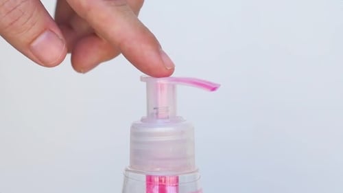 Hand Soap Dispenser Being Used in Close Up