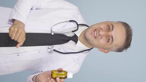 Male Doctor Explains Pill Dosage in Vertical Video