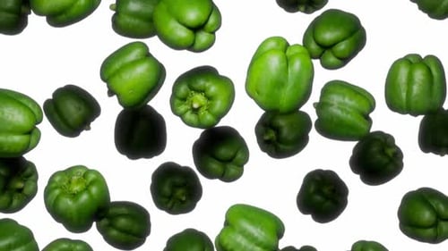 Endlessly Falling Green Bell Peppers on White