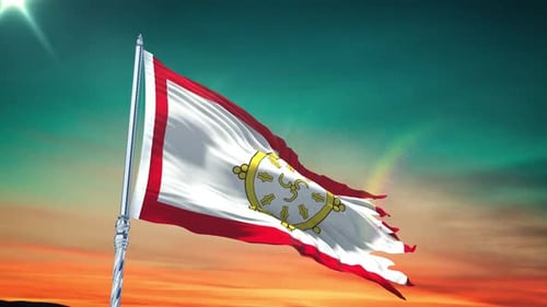 Waving Buddhist Flag with Dharma Wheel Against Sunset Sky