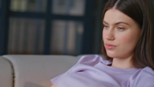 Woman Typing on Laptop Computer at Home