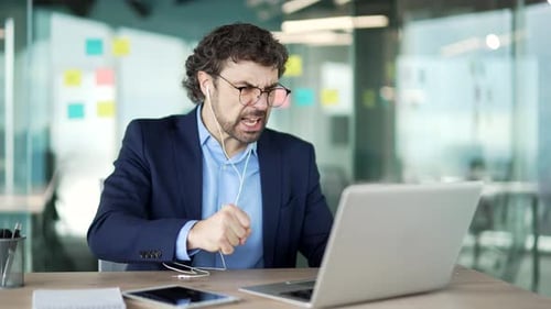Upset Man Arguing During a Meeting Online