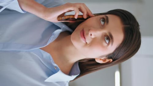 Young Entrepreneur Talking Mobile Phone Closeup Woman Working Office Vertical