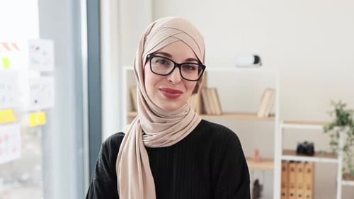Woman in Hijab Smiling and Giving Okay Sign
