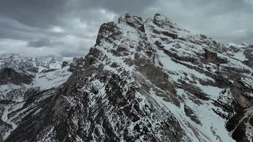 Rocky Snow Mountains and Clouds