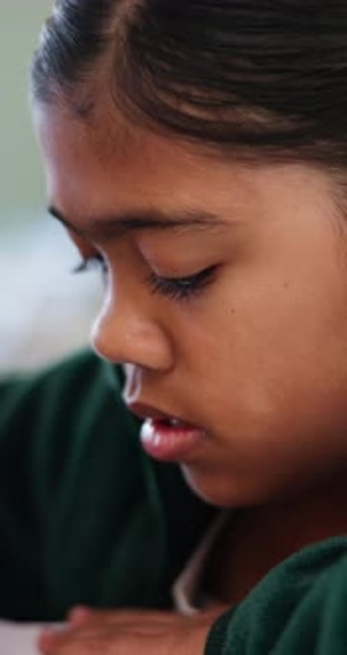 Reading, education and quiz with girl in classroom for test, child development and knowledge