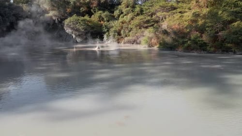 Steaming Geothermal Pool in a Natural Landscape