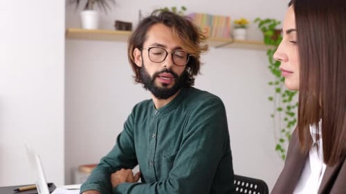 Two Professionals Business Colleagues Working Together on Laptop in Office