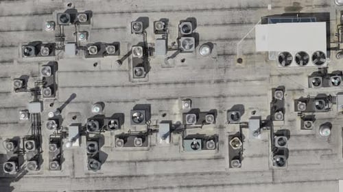 Big Industrial HVAC Air Conditioner System on the Roof Aerial Top Down View