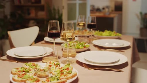 View of Festive Table with Wine and Dishes Ready for Birthday Celebration