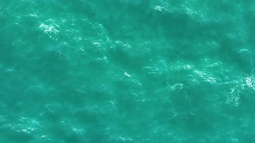 Aerial view of a blue sea water background. Flight over the sea.