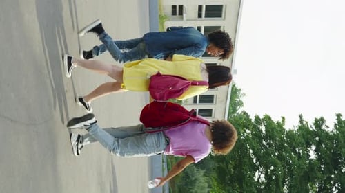 Three Friends Strolling on School Grounds