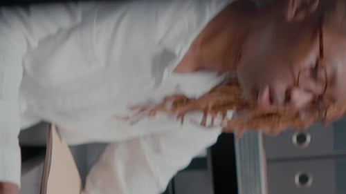 Woman Working At Desk on Laptop Computer Portrait
