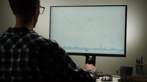 Young Adult Analyzing Graph on Computer With Stylus