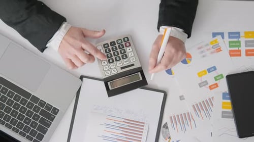 A Girl Accountant is Focused on Compiling Financial Reports and Manages the Accounting of Expenses