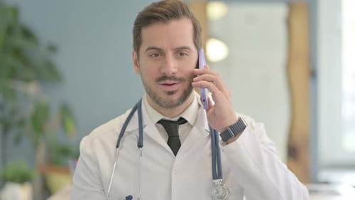 Doctor Talking on Phone in Hospital Close Up