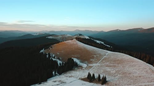 Winter Landscape of Mountains at Sunset From Above