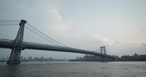 Manhattan Bridge at Dusk with New York City Skyline in the Distance