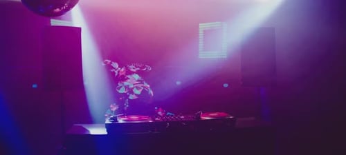 DJ mixing station on stage at club