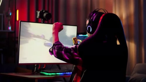 Excited Gamer Playing Racing Video Game