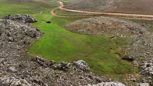 Cinematic Journey Drone's Captivating Footage of Travelers Driving on Mountain Road with Martian