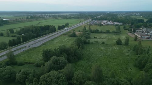 Aerial View of Countryside with Highway and Green Fields Showcasing Rural Landscapes and