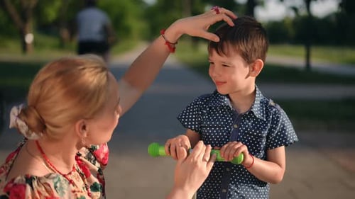 Loving Mother and Son in Urban Park Setting