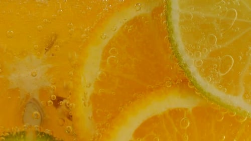 Macro Shot of Citrus Slices and Bubbles