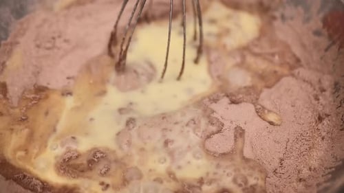 Mixing Ingredients for Dessert in a Bowl