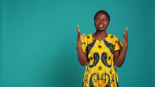 Natural Gorgeous Woman Feeling Positive and Praying in Studio
