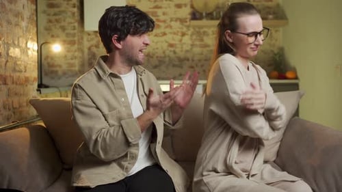 Couple Arguing on Sofa in Cozy Home Interior