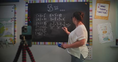 Woman Teaching Math with Chalkboard and Phone