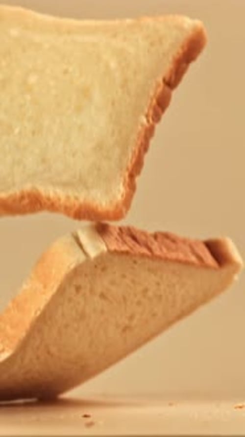 Pieces of Bread Fall on the Table Filmed on a Highspeed Camera at 1000 Fps