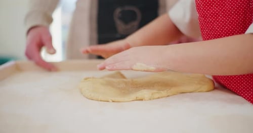 Boy Shapes Dough In The Kitchen Getting Ready To Bake Gingerbread Cookies