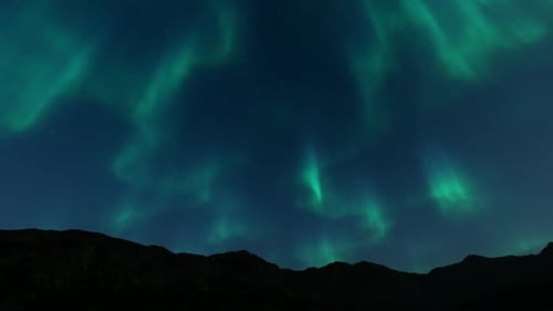 Spectacular Northern Lights Aurora Borealis Over Mountains Night Sky