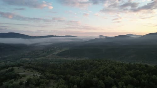 Evening Forestainous, mountain areas foggy clouds, drone view of coniferous pine forest, footage fro