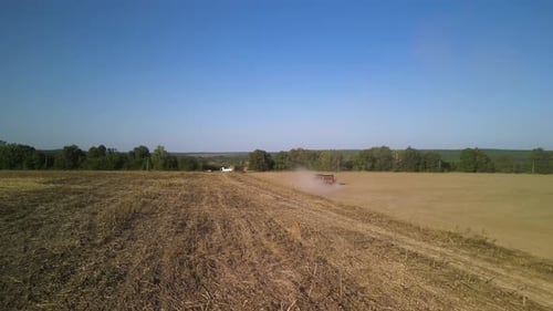Tractor on the field seeding wheat