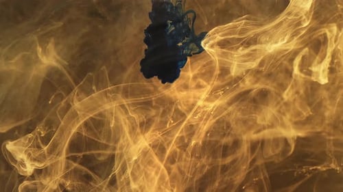 Dark Blue Ink Flowing into Golden Fluid