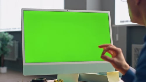 Manager video calling greenscreen computer explaining marketing strategy at office