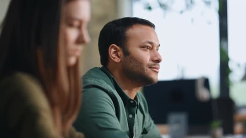Busy Corporate Staff Talking Working at Laptops in Conference Room Close Up