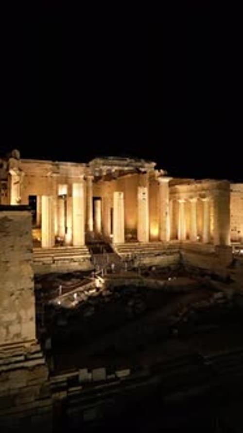 Aerial shots of the illuminated Acropolis of Athens, Greece at night