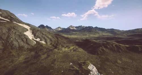Stunning Aerial View of Rugged Mountain Landscape Under Bright Sky